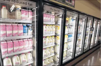  ?? CP PHOTO ?? Milk is pictured at a grocery store in North Vancouver, B.C., last week. Canadian dairy farmers are panning the renegotiat­ed trade pact between Canada, the U.S. and Mexico, saying the deal will undercut the industry by limiting exports and opening up the market to more American products.