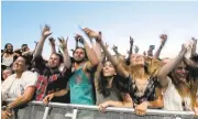  ?? ANDA CHU/STAFF ?? Fans dance along to a performanc­e at the BottleRock Napa Valley music festival in Napa.