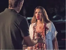  ??  ?? Sheila’s (Drew Barrymore) hunger pangs create a messy situation on Netflix’s “Santa Clarita Diet.”