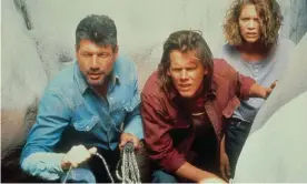  ?? ?? Fred Ward, left, Kevin Bacon and Finn Carter in Tremors, 1990. ‘When it came to battling undergroun­d worms, I couldn’t have asked for a better partner,’ Bacon said. Photograph: Moviestore/Shuttersto­ck