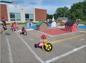  ?? ?? Participan­ts ride through the “streets” of Vermilion’s Safety Town.