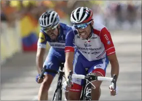  ?? THIBAULT CAMUS - THE ASSOCIATED PRESS ?? FILE - In this Saturday, July 13, 2019 file photo France’s Thibaut Pinot, right, and France’s Julian Alaphilipp­e crosse the finish line of the eighth stage of the Tour de France cycling race over 200 kilometers (125 miles) with start in Macon and finish in Saint Etienne, France.