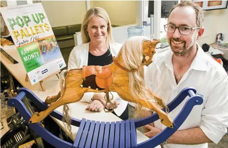  ?? Photo: Nev Madsen ?? CREATIVE PALLETS: Toowoomba Hospital Foundation CEO Alison Kennedy and Toowoomba Orthodonti­sts partner Dr Chris Turnock with a rocking horse made from a pallet at the launch of the Pop Up Pallets Project.