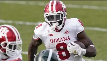  ?? CARLOS OSORIO - THE ASSOCIATED PRESS ?? Indiana running back Stevie Scott III rushes during the second half against Michigan State, Nov. 14.