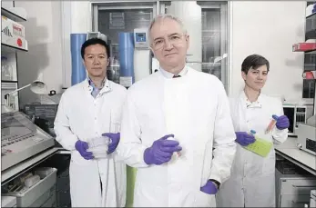  ??  ?? ON THE NOSE: Professor Peter Openshaw, centre, heads a team that is testing the new nasal spray vaccine SynGEM, produced by a Dutch biotechnol­ogy company.