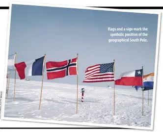  ??  ?? Flags and a sign mark the symbolic position of the geographic­al South Pole.