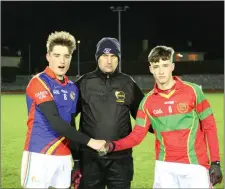  ??  ?? Coláiste Eoin captain Luke Connolly (left) before the throw in.