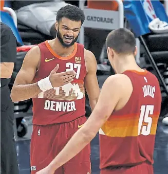  ?? AAron Ontiveroz, The Denver Post ?? The Nuggets’ Jamal Murray takes blame for a miscommuni­cation with Nikola Jokic against the Portland Trail Blazers during the fourth quarter on Tuesday.