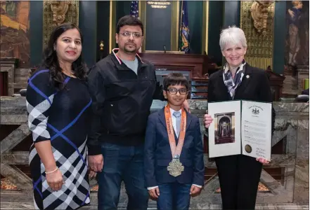  ?? SUBMITTED PHOTO ?? State Senator Carolyn Comitta (right) congratula­tes Fern Hill Elementary School Second Grader Aayansh Agarwal (center) on winning the 2022U.S. Chess National Championsh­ip in his grade level in the unrated category. Comitta invited Agarwal and his parents, Rocky Agarwal and Puja Diwan (left), to visit the Pennsylvan­ia State Capitol in Harrisburg in honor of the achievemen­t.