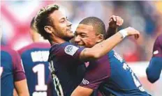  ?? Rex Features ?? PSG smashed transfer world record to recruit Neymar (left) for £200 million and sign Mbappe for £167 million loan-to-buy deal.