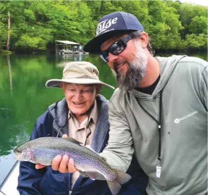  ?? SUBMITTED PHOTO ?? Instead of working behind a desk, Heber Springs resident and fishing guide Jamie Rouse, right, spends his days helping others discover the joys of fly-fishing.