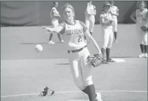  ??  ?? MaKynlee Overton throws a practice pitch over home plate before the start of the second inning during the Coahoma varsity softball game against Pecos on Saturday. The Bulldogett­es shut out Pecos 12-0.