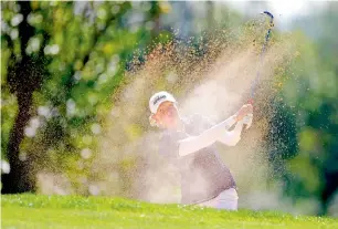  ?? AFP ?? Stacy Lewis hits out of the bunker on the fifth hole. —