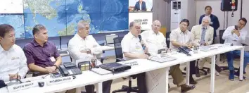  ??  ?? Jaime Zobel de Ayala and Manuel V. Pangilinan (third and fourth from left) during the briefing at the Command Center of the new National Emergency Operations Center. With them are (from left) Philippine Disaster Resilience Foundation president Butch...