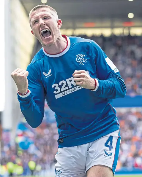  ?? ?? John Lundstram celebrates his spectacula­r strike against Ross County at Ibrox