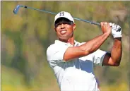  ?? AP PHOTO BY RYAN KANG ?? Tiger Woods tees off on the fourth hole during the second round of the Genesis Open golf tournament at Riviera Country Club, Friday in the Pacific Palisades area of Los Angeles.