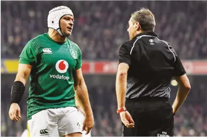  ??  ?? Appeal: Rory Best complains to referee Jerome Garces after England’s third try