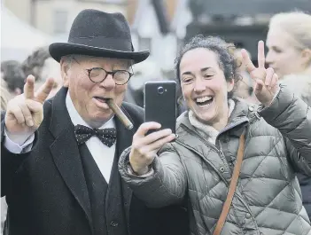  ??  ?? Sir Winston Churchill (Peter Austwick) has a selfie with a delighted Melanie Challenger. 164317a