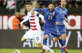  ?? FRANCISCO SECO — ASSOCIATED PRESS ?? United States’ Christian Pulisic, left, and Italy’s Stefano Sensi fight for the ball during an internatio­nal friendly Nov. 20 in Genk, Belgium.