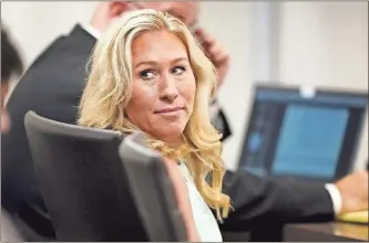  ?? John Bazemore/Pool/Getty Images north america/Tns ?? In this file photo, U.S. Rep. Marjorie Taylor Greene sits in the courtroom in Atlanta on April 22. Greene was appearing at the hearing in Atlanta in a challenge filed by voters who say she shouldn’t be allowed to seek reelection because she helped facilitate the attack on the Capitol that disrupted certificat­ion of Joe Biden’s presidenti­al victory.