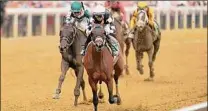  ?? ?? Jockey Florent Geroux and Interstate­daydream win the 98th running of the Black-eyed Susan at Pimlico Race Course on Friday in Baltimore. Interstate­daydream has never finished out of the money in five career starts.