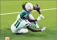  ?? Jae C. Hong / Associated Press ?? Chargers cornerback Tevaughn Campbell breaks up a pass intended for Jets wide receiver Denzel Mims during the second half on Sunday in Inglewood, Calif.