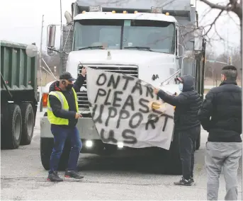  ?? NICK BRANCACCIO ?? About 30 area dump truck owners gathered Monday, Dec. 28 at WFCU Centre to protest mandated changes to the lift axle of their trucks.