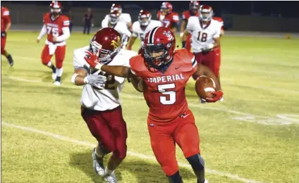  ?? PHOTO AARON BODUS ?? Imperial’s Joey Ramos (5) says no to a would-be tackler. Ramos had a big game for the Tigers as they claimed their first home win of the 2019 season, 26-25 over Monte Vista.