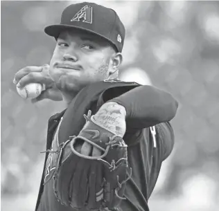  ?? RICK OSENTOSKI/ USA TODAY SPORTS ?? D-Backs starting pitcher Taijuan Walker came off the disabled list to start Wednesday night’s game against the Tigers in Detroit. Walker pitched five innings, allowing one run on six hits and a walk. He struck out six.