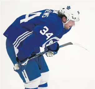  ?? NATHAN DENETTE THE CANADIAN PRESS FILE PHOTO ?? Toronto Maple Leafs forward Auston Matthews catches his breath as he works on his conditioni­ng last week at training camp. Matthews had surgery in August to repair his left wrist.