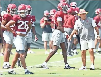  ?? Ben Flanagan ?? Nick Saban coaches up the defensive backs. The Alabama football team practices in Tuscaloosa on Aug. 9.