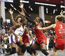  ?? CURTIS COMPTON — ATLANTA JOURNAL-CONSTITUTI­ON VIA AP ?? Atlanta Dream defenders Nia Coffey, from left, Cheyenne Parker and Kristy Wallace smother Sparks forward Chiney Ogwumike.