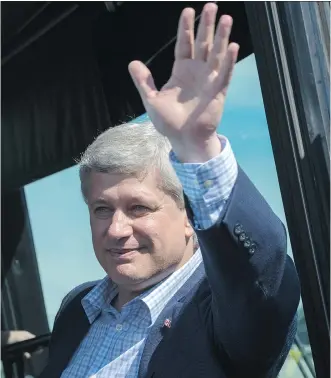  ?? THE CANADIAN PRESS ?? Conservati­ve Leader Stephen Harper waves to supporters following a campaign stop on Monday in Kingston, Ont.