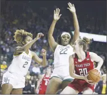  ?? (AP) ?? Texas Tech forward Brittany Brewer (right), is guarded by Baylor center Erin DeGrate and DiDi Richards (left), in the first half of an NCAA college
basketball game on Jan 25 in Waco, Texas.