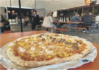  ??  ?? A 20in pizza at Beach Box with half Mac’E’Deez.