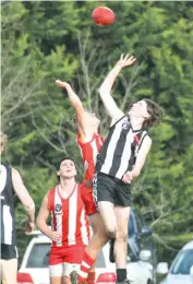  ??  ?? Jye Wilson of Yinnar has the better of this ruck contest against Sean Pearse-Clarke in the fourths on Saturday.