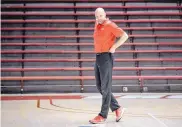  ?? ROBERTO E. ROSALES/ JOURNAL ?? Craig Snow walks the floor at Dreamstyle Arena - the Pit during a preseason practice. Snow is in his second term on the UNM men’s basketball staff.