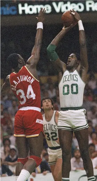  ?? AP FILe PHOTO ?? TALL ORDER: Robert Parish shoots over Houston’s Akeem Olajuwon during the NBA Finals on May 27, 1986.