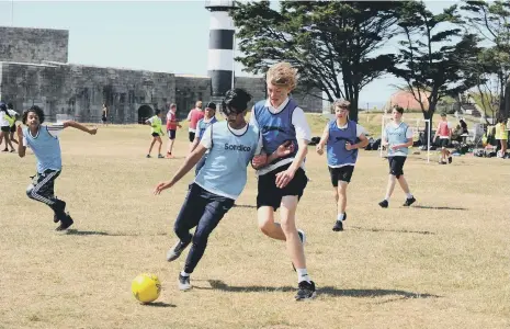  ?? ?? The Priory School Year 10s playing football. Pictures: Sarah Standing (160622-6788)