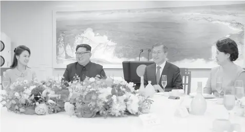 ?? AGENCE FRANCE PRESSE ?? This picture taken on April 27 and released by North Korea's official Korean Central News Agency (KCNA) shows North Korea's leader Kim Jong Un (2nd L) and his wife Ri Sol Ju (L) attending the official dinner with South Korea's President Moon Jae-in...