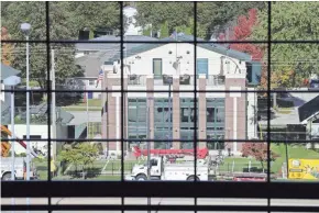  ?? JIM MATTHEWS / USA TODAY NETWORK-WISCONSIN ?? A four-story house at 1225 Shadow Lane, owned by Robert and Patricia Endries of Brillion, can be viewed through the glass wall of the Lambeau Field Atrium in Green Bay.