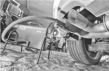  ??  ?? In this file photo a measuring hose for emissions inspection­s in diesel engines sticks in the exhaust tube of a Volkswagen (VW) Golf 2,0 TDI diesel car at a garage in Frankfurt an der Oder, eastern Germany. The first major court case against Volkswagen over its cheating of emissions tests on 11 million diesel vehicles worldwide begins on September 10. — AFP photo