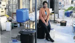  ?? THULANI MBELE ?? Wits student Busisiwe Mashiane, 22, has created a water purificati­on system using sand and the sun.