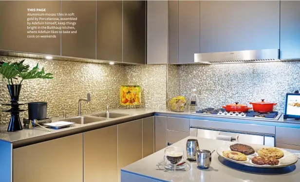  ??  ?? THIS PAGE
Aluminium mosaic tiles in soft gold by Porcelanos­a, assembled by Adefuin himself, keep things bright in the Bulthaup kitchen, where Adefuin likes to bake and cook on weekends