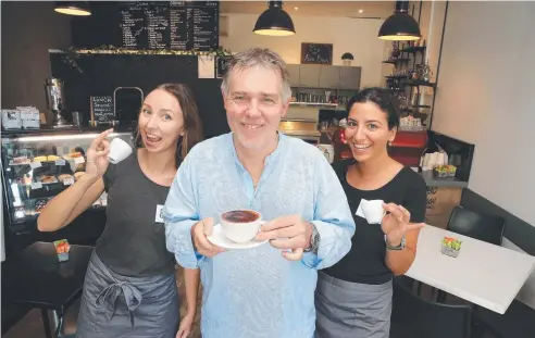 ?? Picture: JUSTIN BRIERTY ?? AT YOUR SERVICE: Semra Cafe owner Volker Franz with staff Emelie Mattsson (left) and Melanie Zaytat.