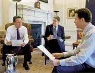  ??  ?? With David Cameron and Nick Clegg in 2010