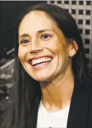  ?? David Zalubowski / Associated Press ?? Former UConn star Sue Bird jokes with reporters as she talks about her new role as basketball operations assistant for the Denver Nuggets.