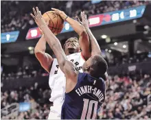  ?? FRANK GUNN THE CANADIAN PRESS ?? Toronto Raptors guard Kyle Lowry drives to the net as Dallas Mavericks forward Dorian Finney-Smith tries to block during NBA basketball action in Toronto on Friday.