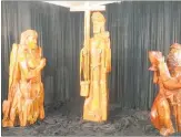  ??  ?? Michael Mabey’s imposing wood sculptures of Jesus, Mary Magdalene and the return of the Holy Grail.