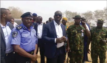  ??  ?? Governor of Edo State, Mr. Godwin Obaseki (third from right), flanked by the state Commission­er of Police, Mr. Johnson Kokumo (left); Commander of 4 Brigade, Nigerian Army, Major General Ibrahim Garba (right) with other government officials and...